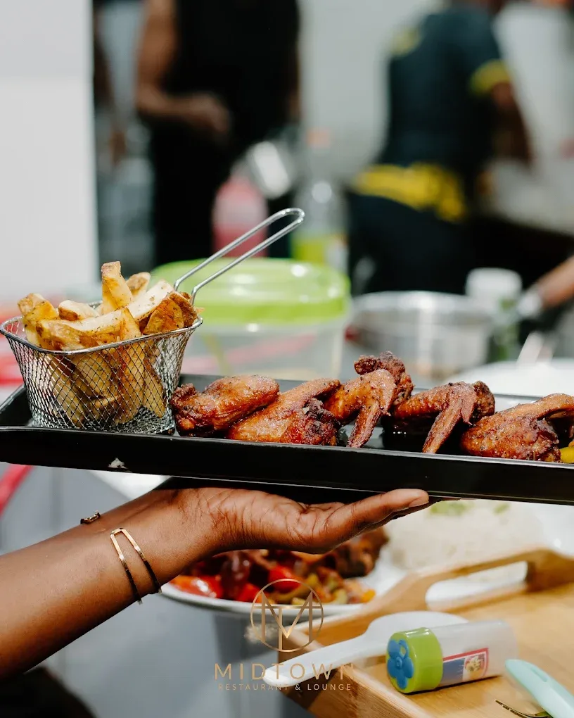 Wings and fries carried out from the Midtown kitchen